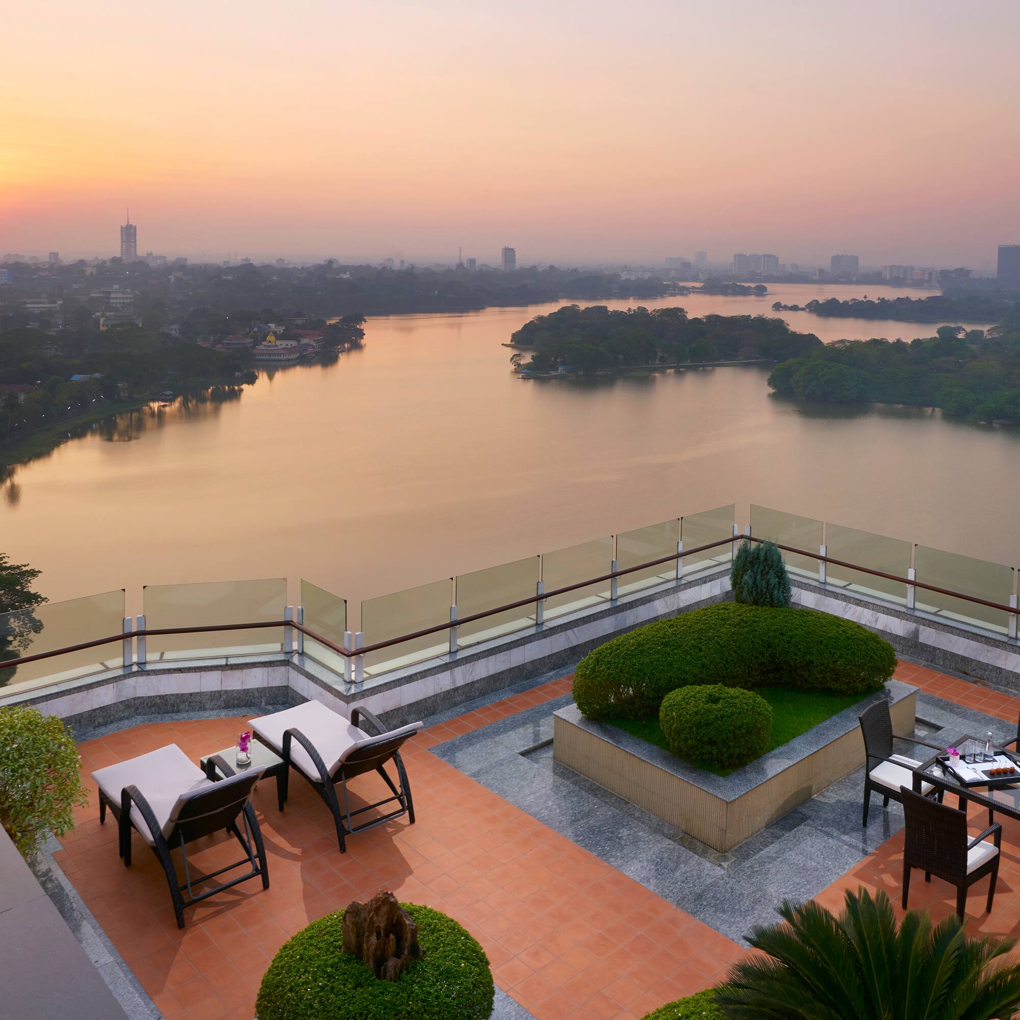 a rooftop patio overlooking a body of water