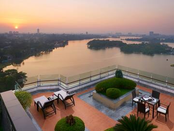 a rooftop patio overlooking a body of water