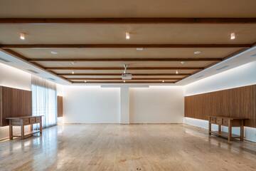 a room with a wood ceiling and a table