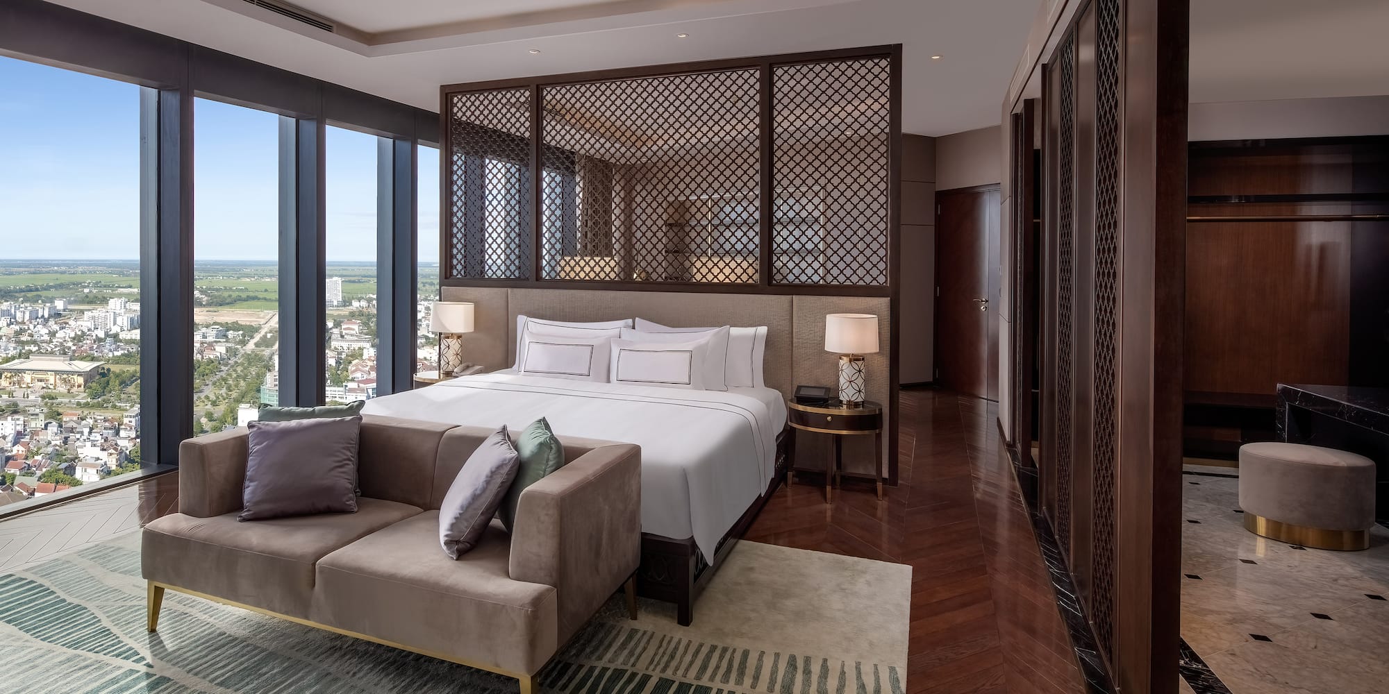 a bedroom with a bed and a couch