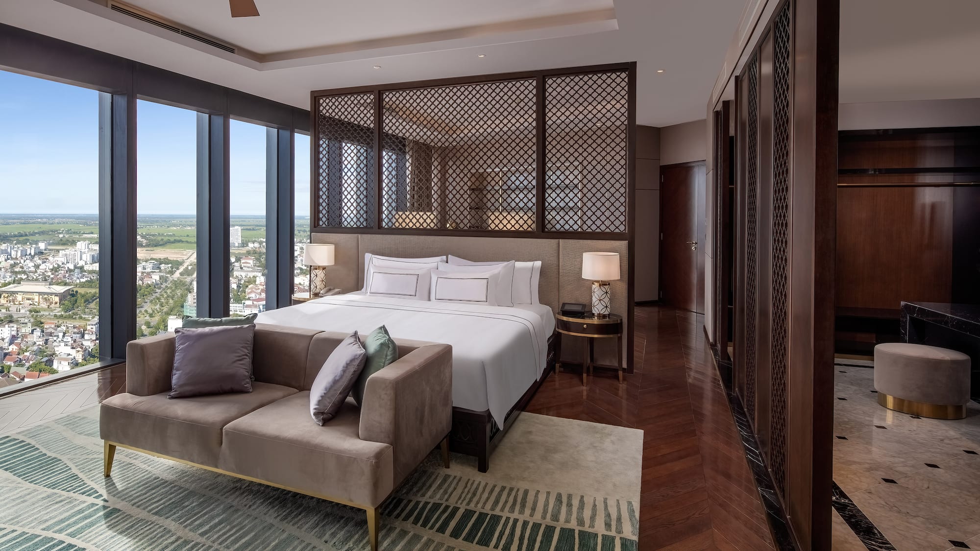 a bedroom with a bed and a couch