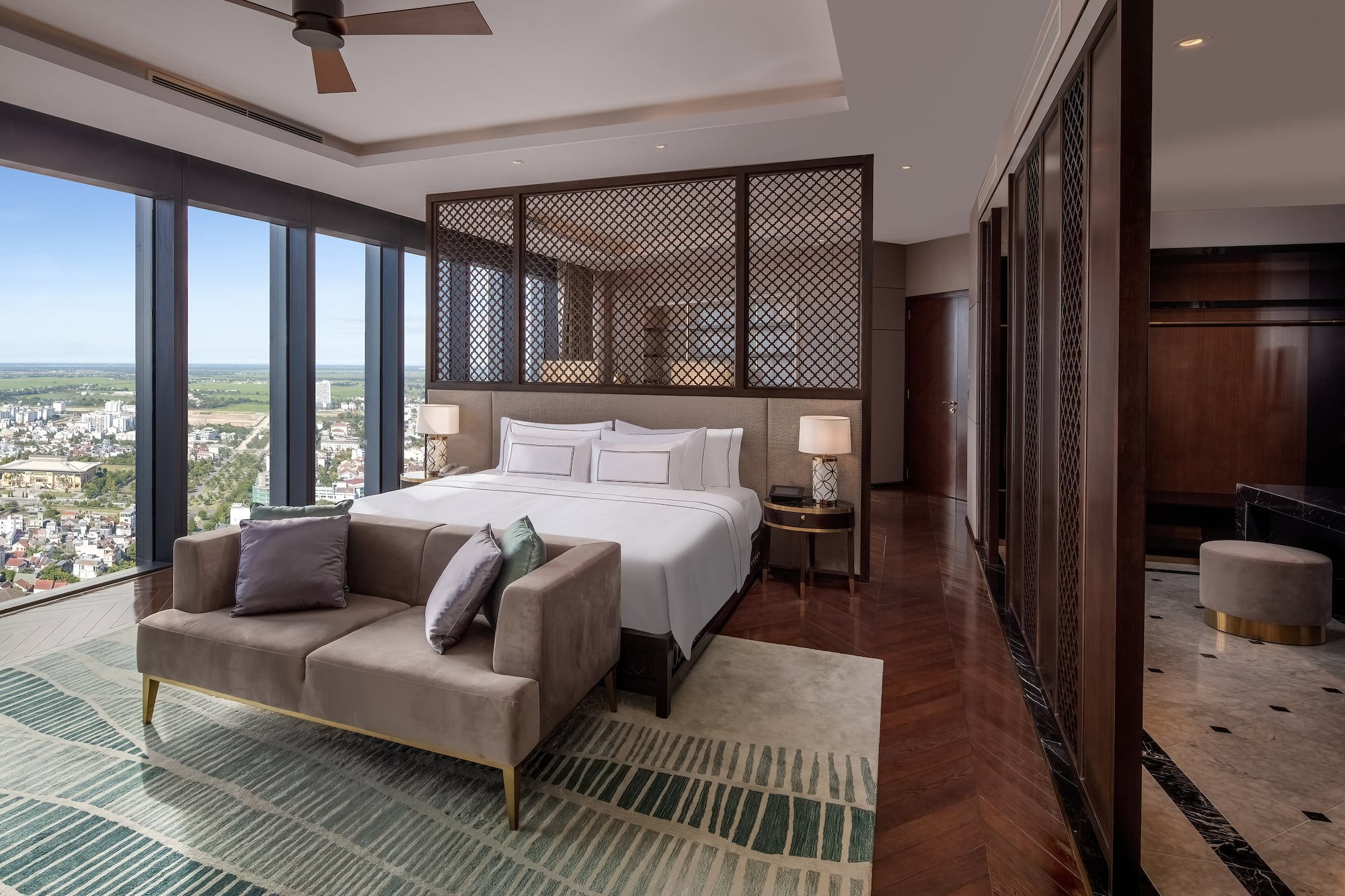 a bedroom with a bed and a couch