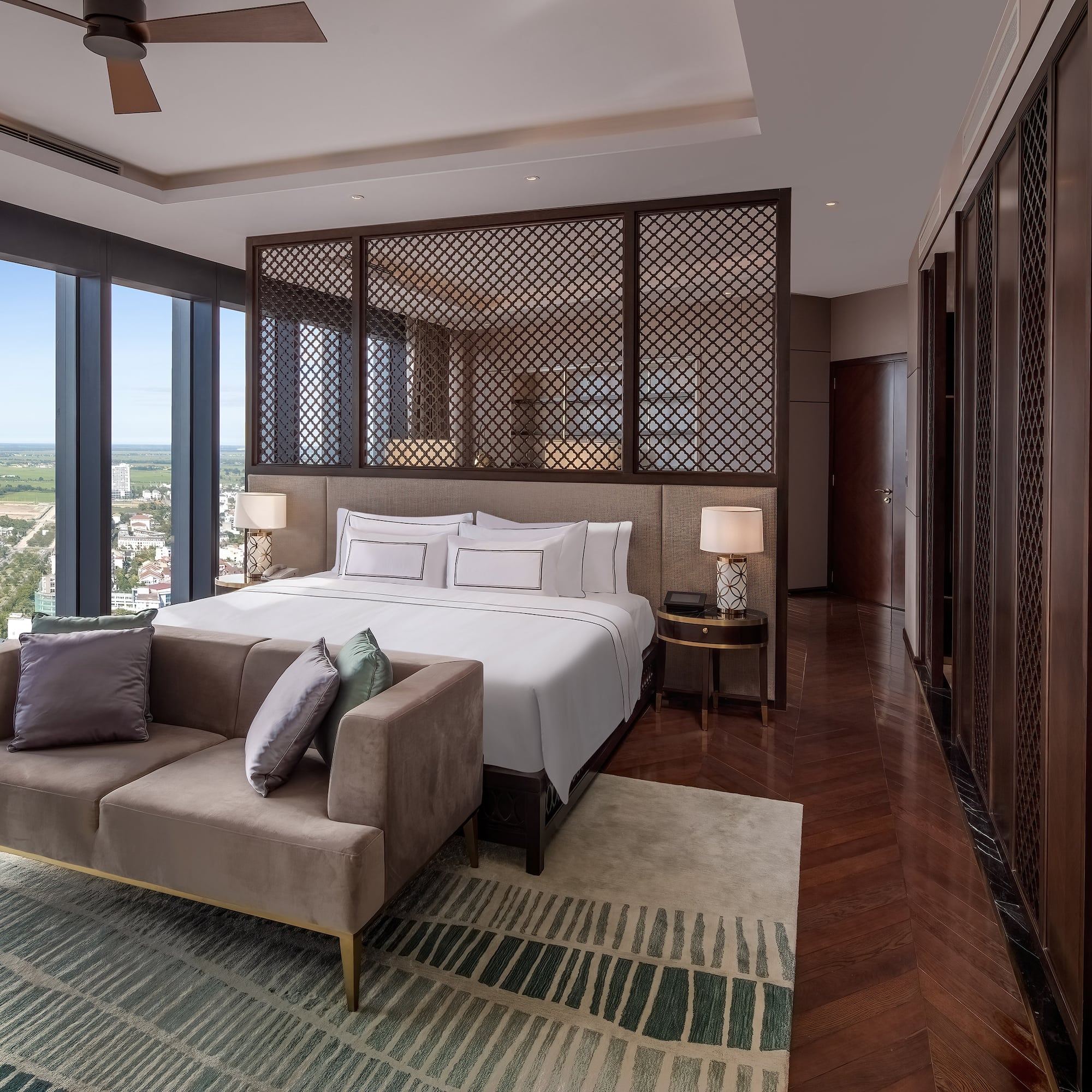 a bedroom with a bed and a couch