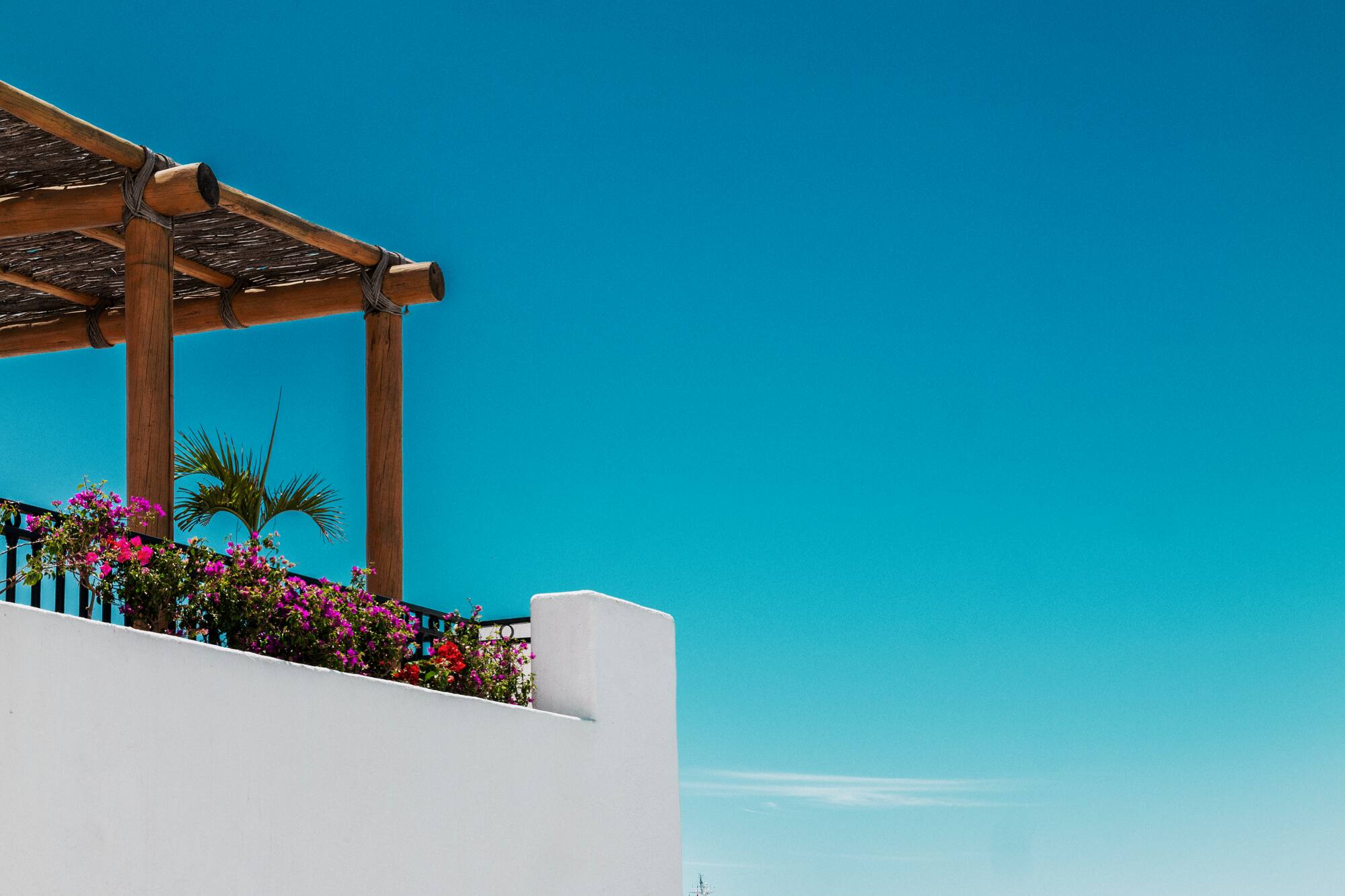 a white wall with a boat in the water