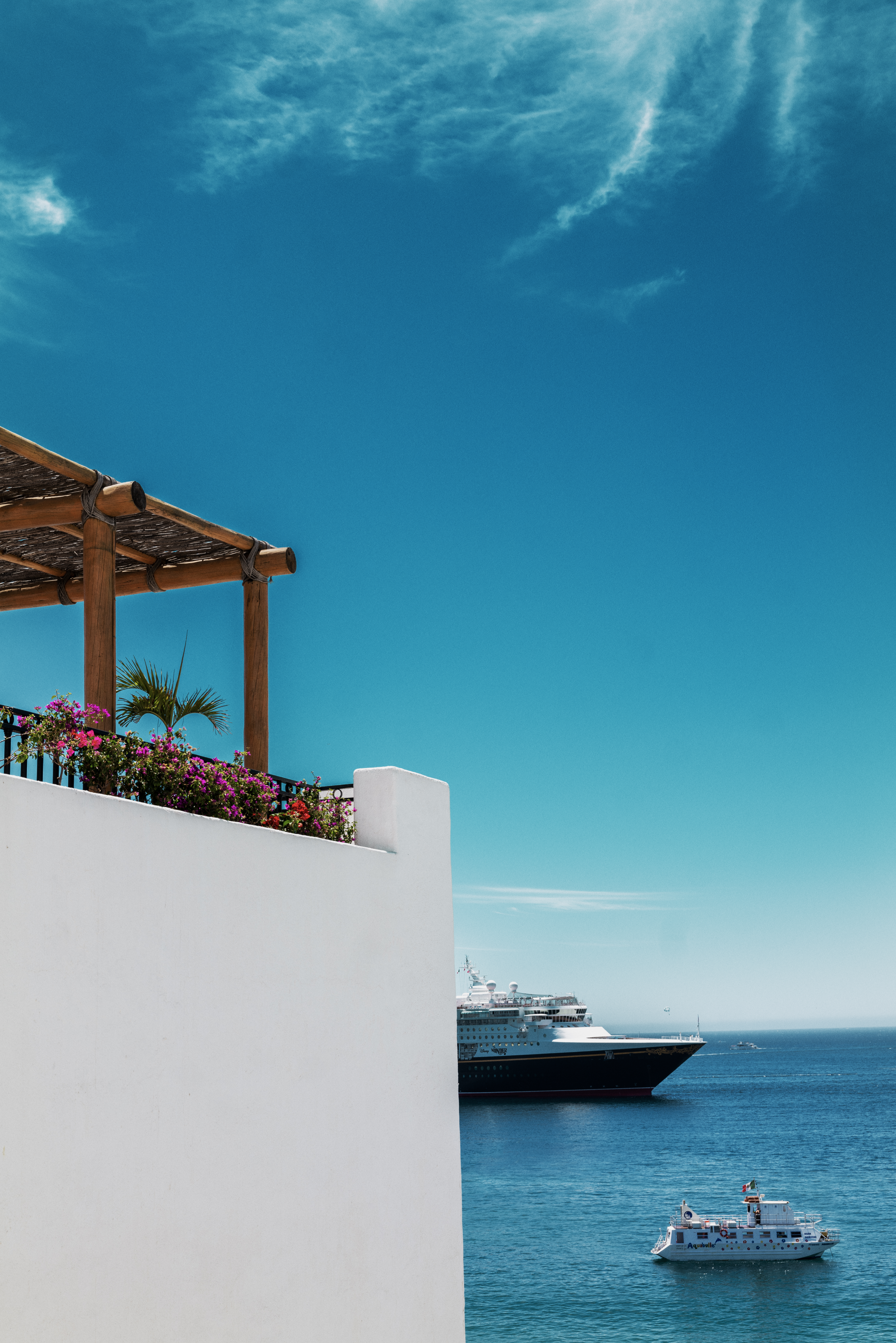 a white wall with a boat in the water
