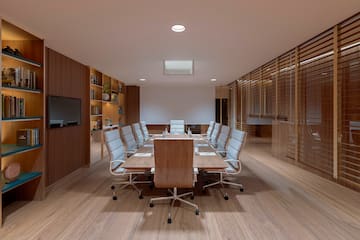 a conference room with a table and chairs