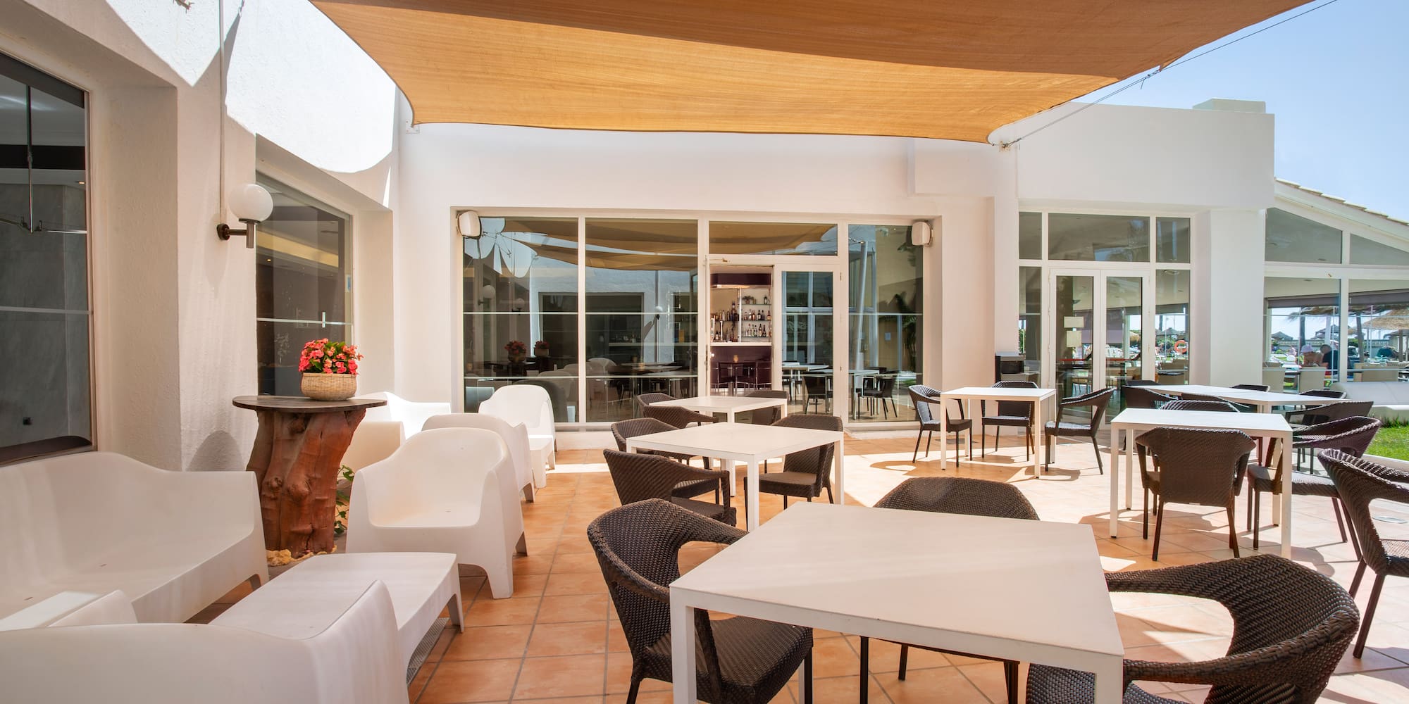 a patio with chairs and tables