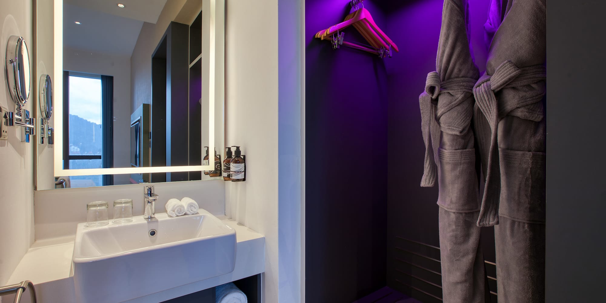 a bathroom with purple lighting