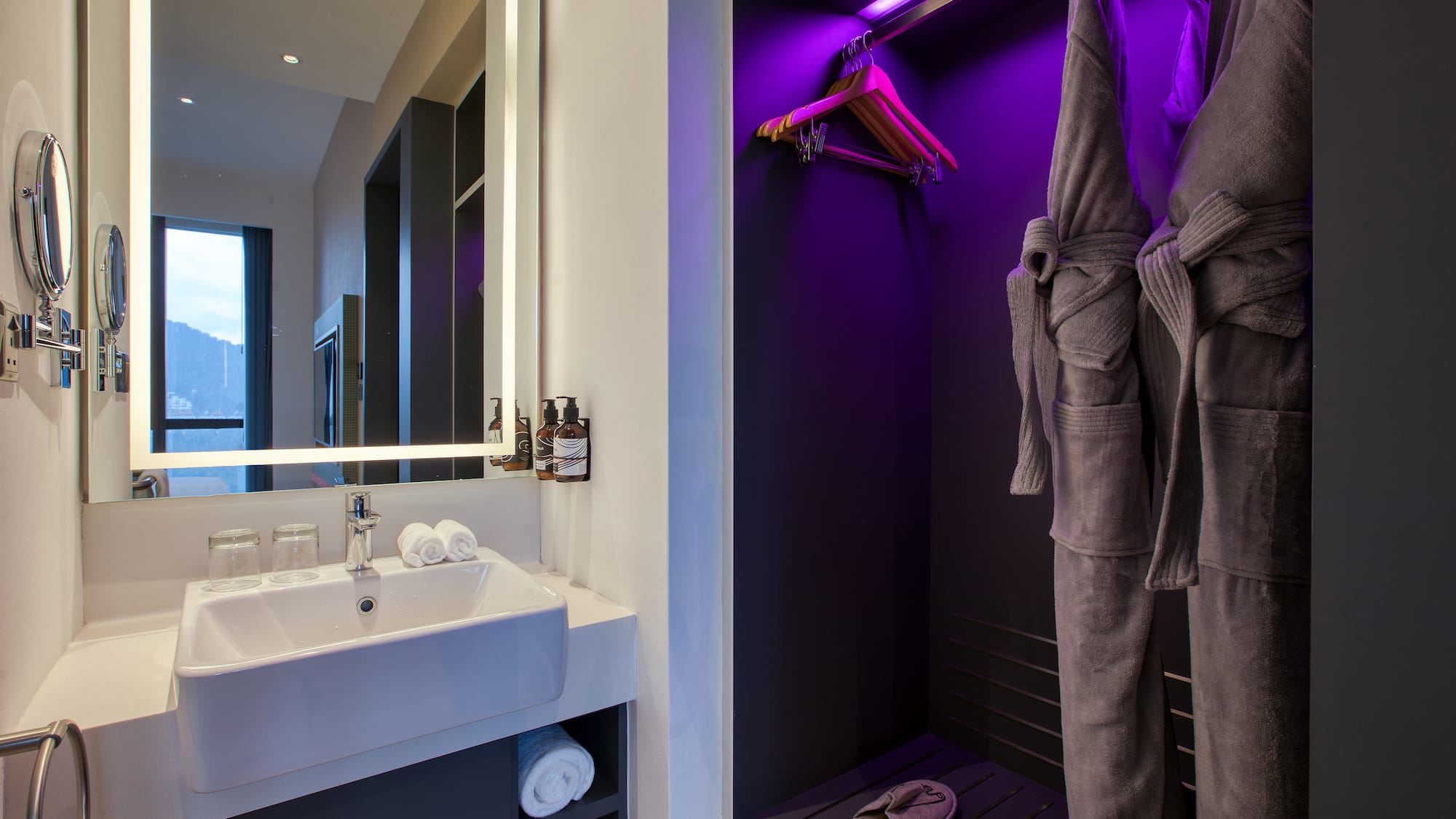 a bathroom with purple lighting
