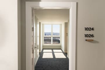 a hallway with a door and a window
