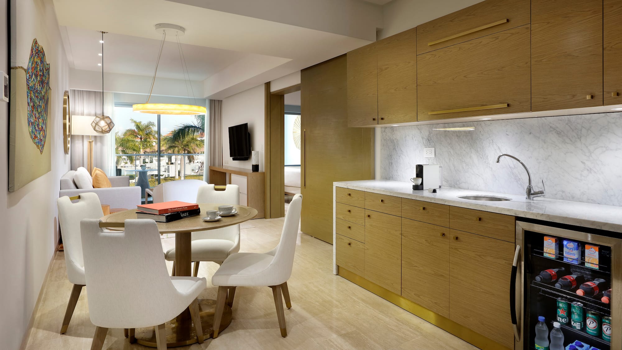a kitchen and dining area with a table and chairs