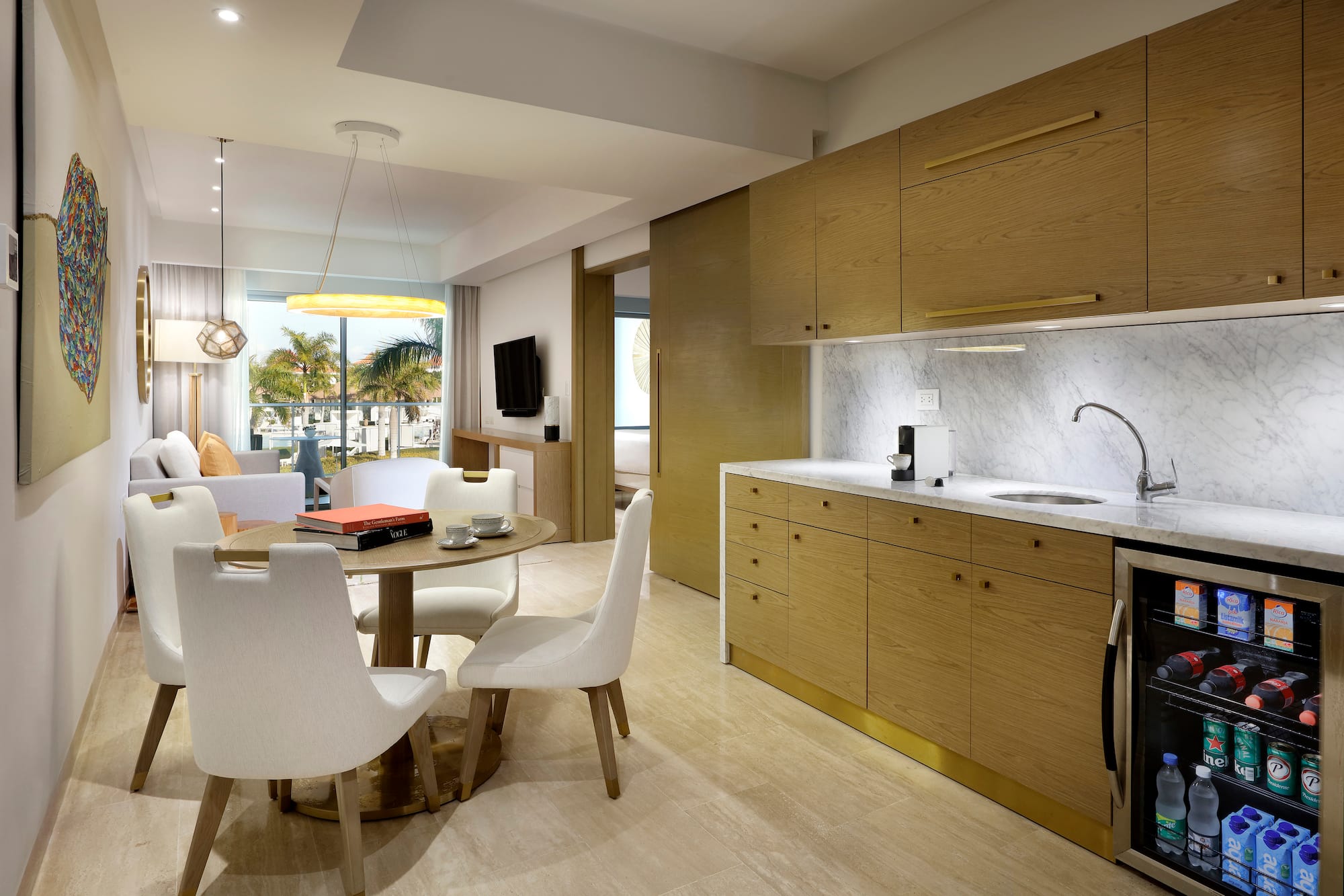 a kitchen and dining area with a table and chairs