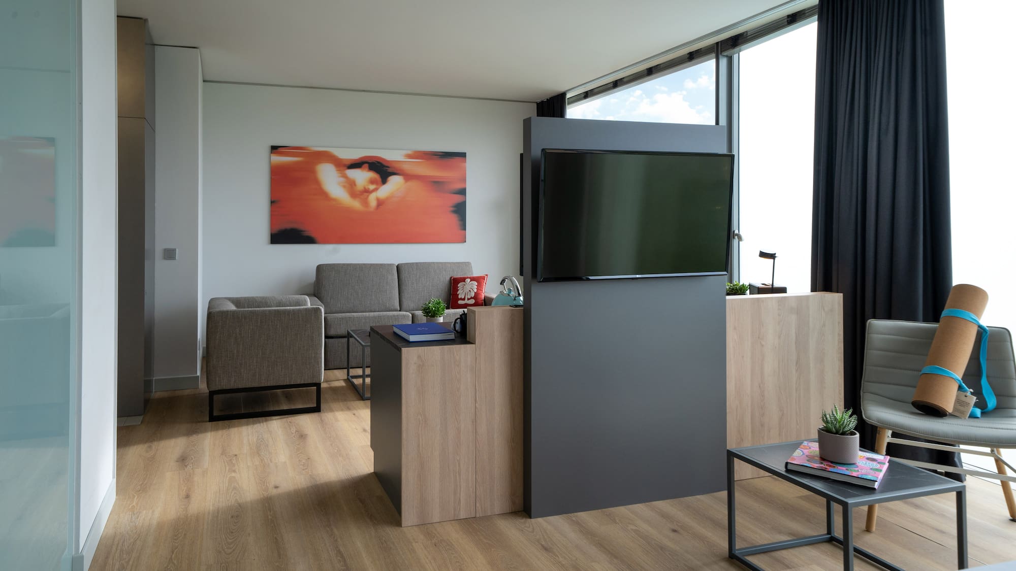 a room with a tv and a couch