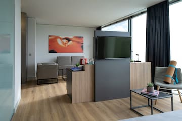 a room with a tv and a couch