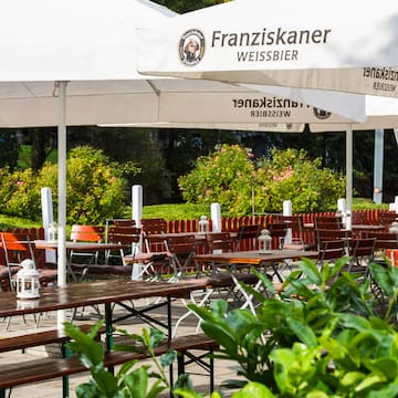 tables and chairs under a canopy