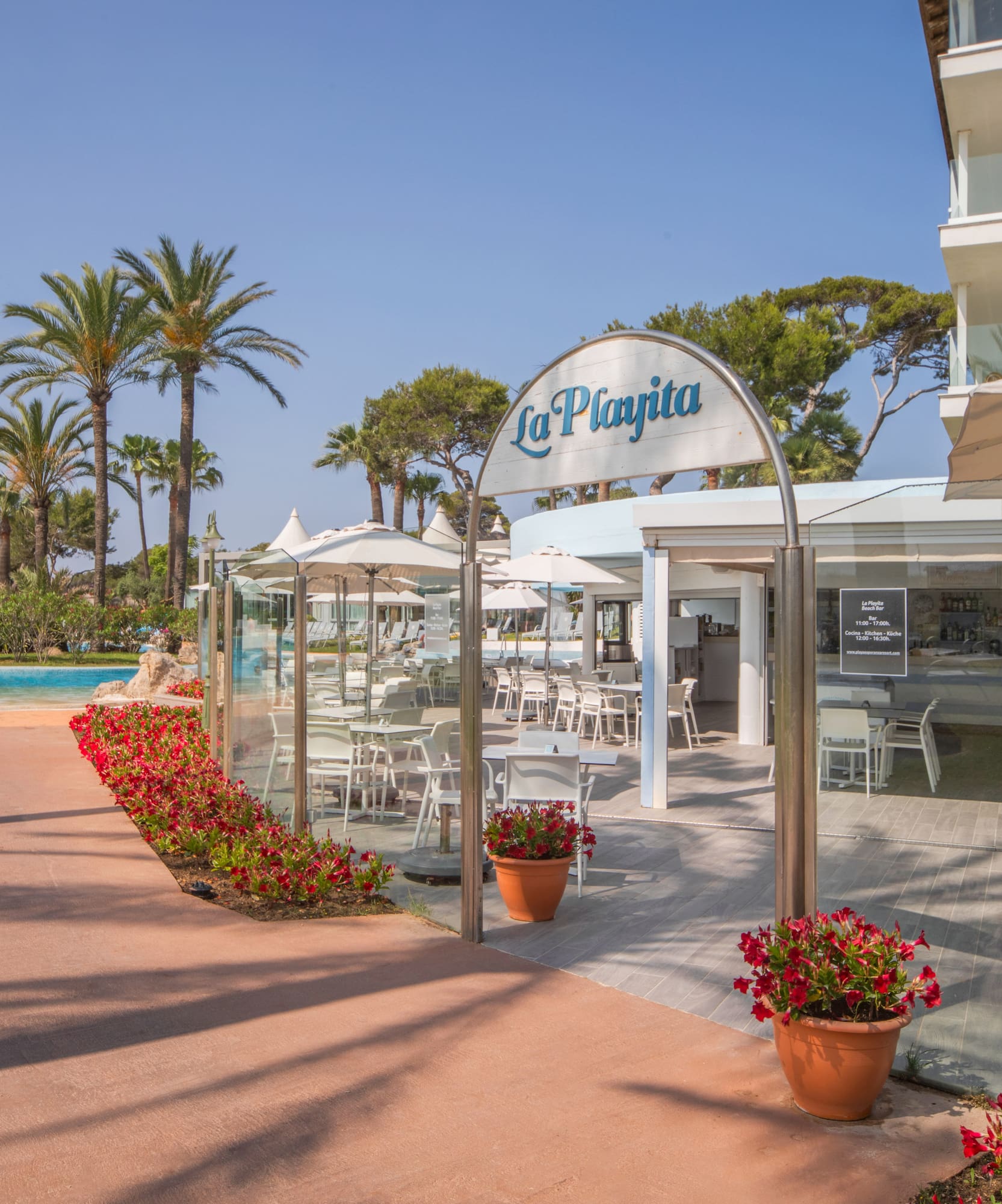 a pool and a building with a sign