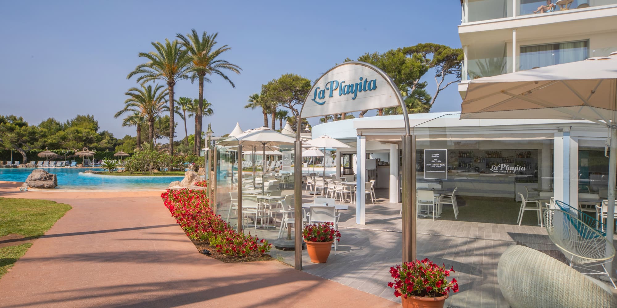 a pool and a building with a sign