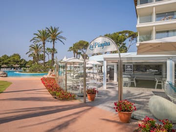 a pool and a building with a sign