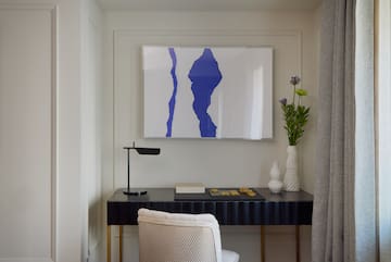 a desk with a painting on it