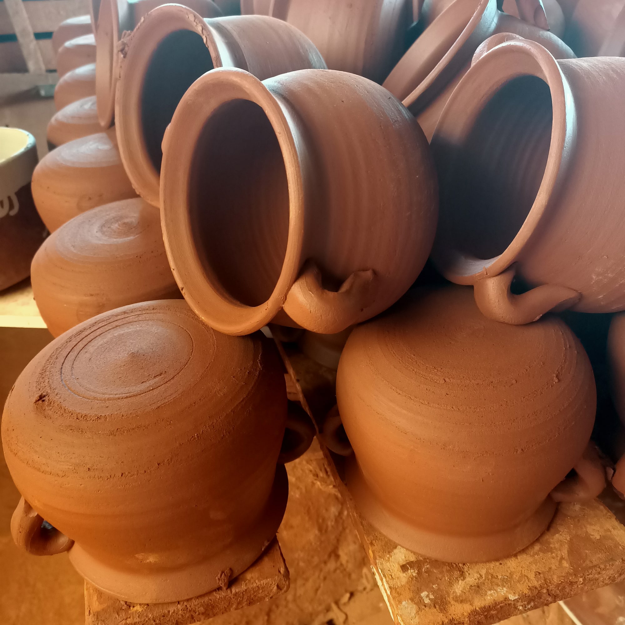 a stack of brown pots