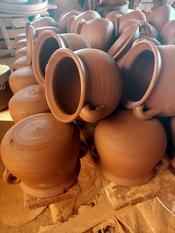 a stack of brown pots