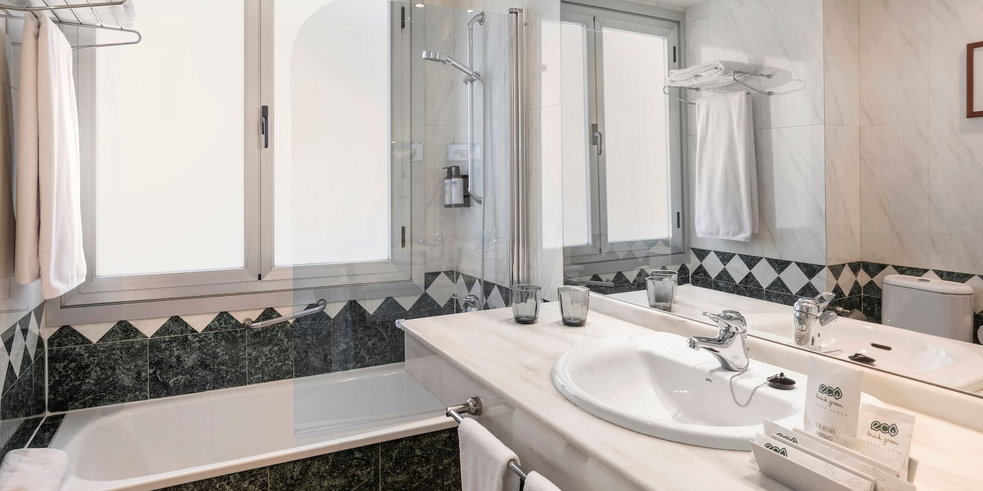 a bathroom with a tub and sink