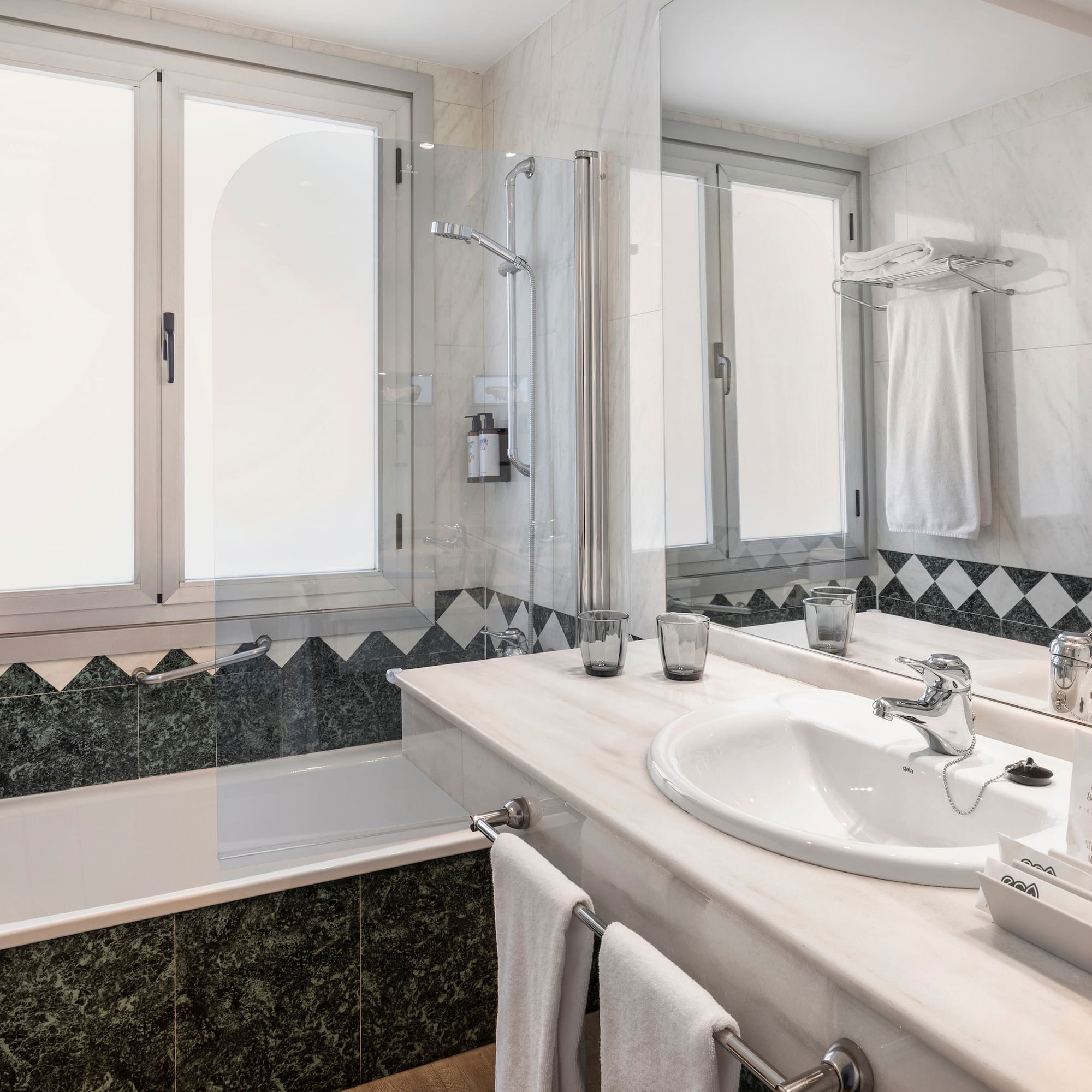 a bathroom with a tub and sink