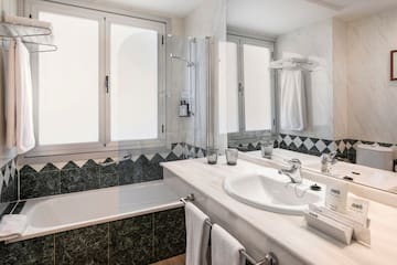 a bathroom with a tub and sink