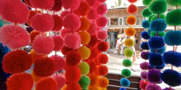 a colorful pom poms from a store window
