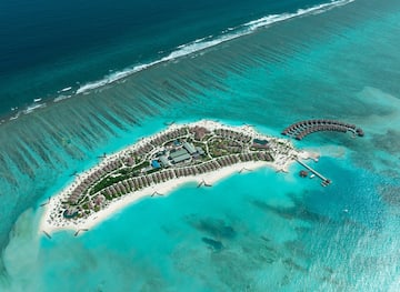 an island with buildings and a body of water