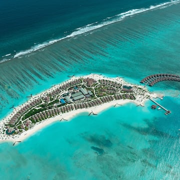 an island with buildings and a body of water