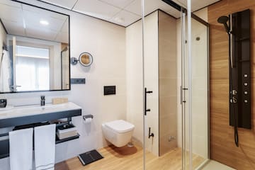 a bathroom with a shower and toilet