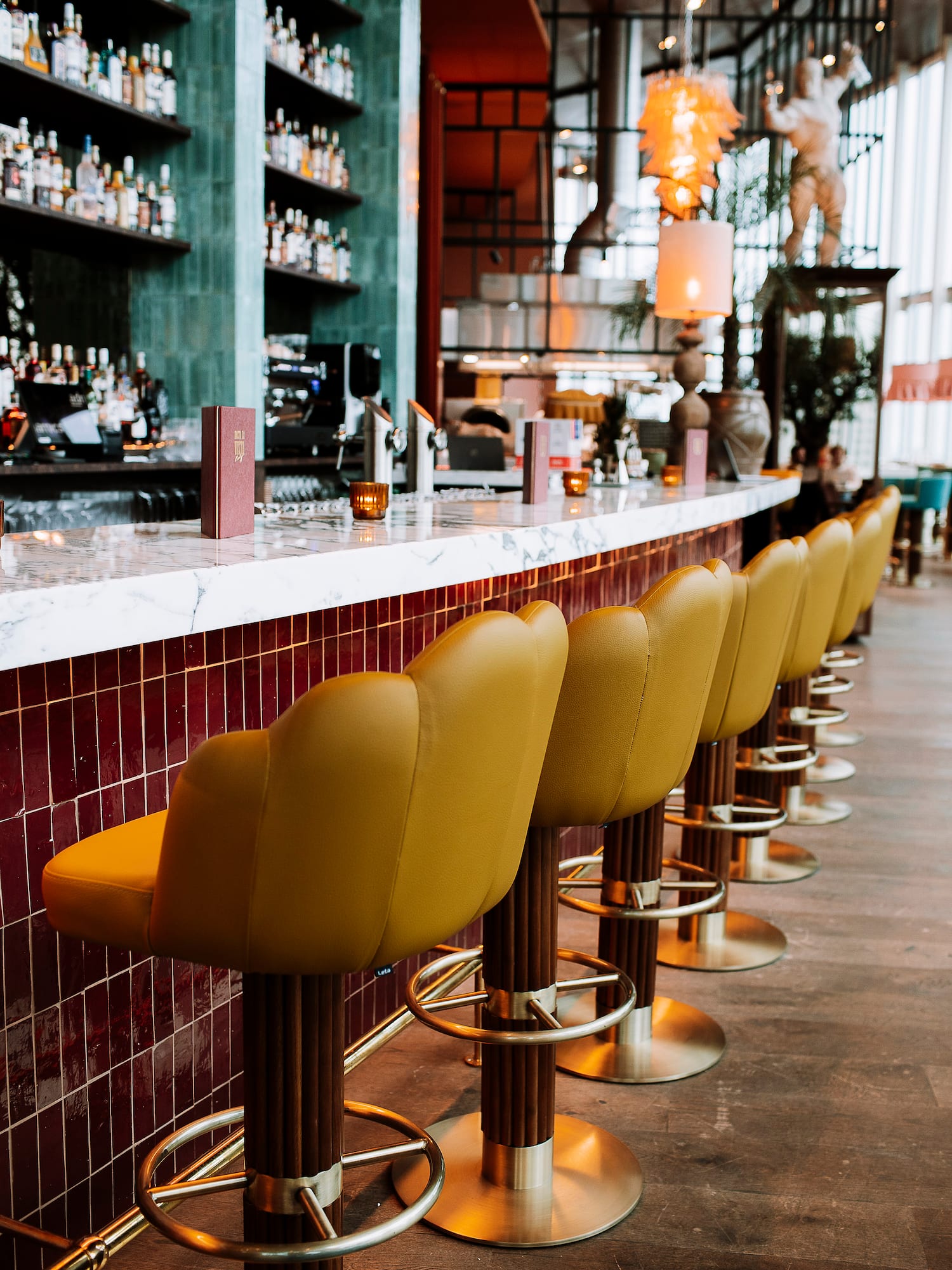 a row of chairs in a bar