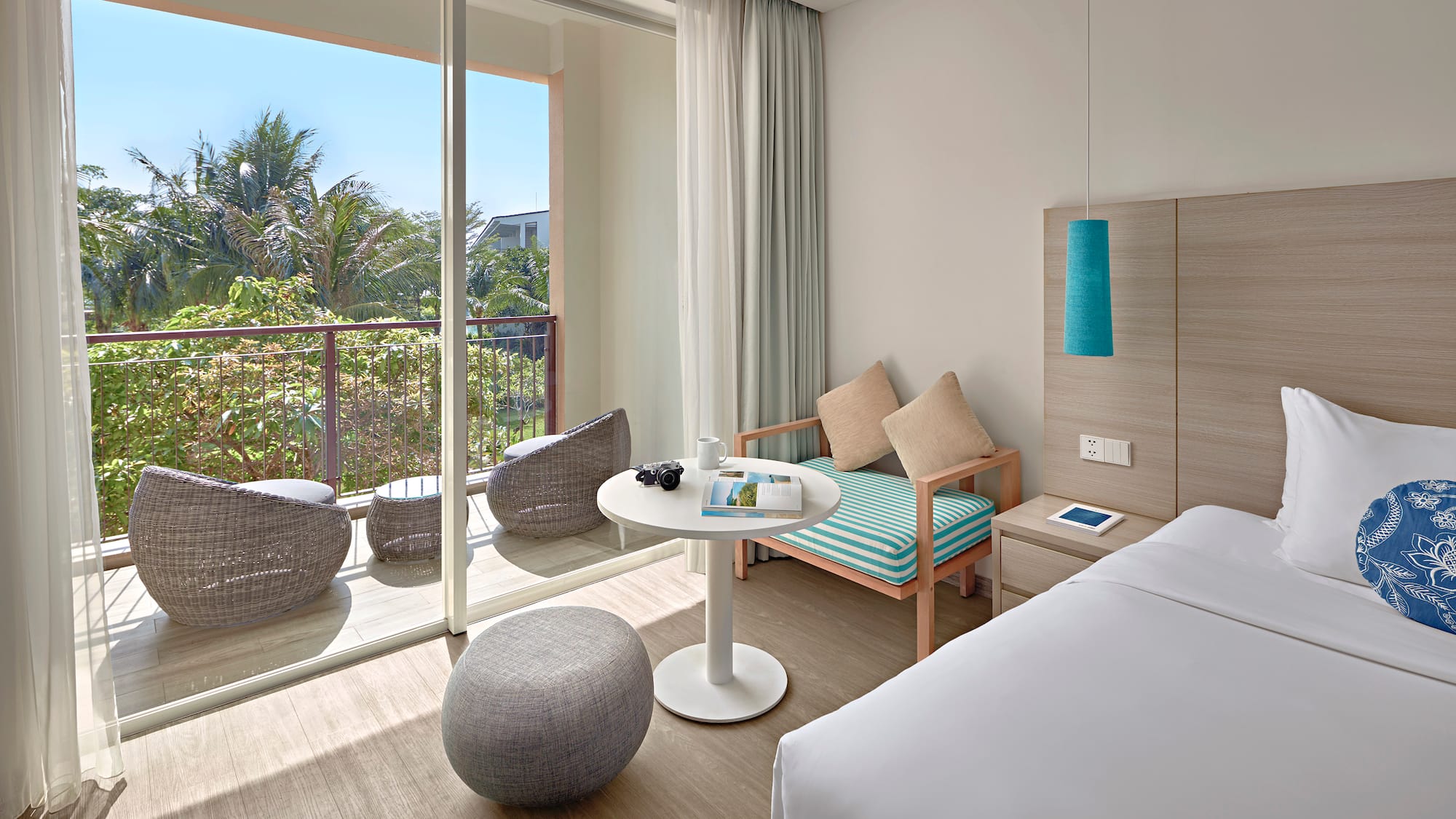 a room with a bed and a table and chairs