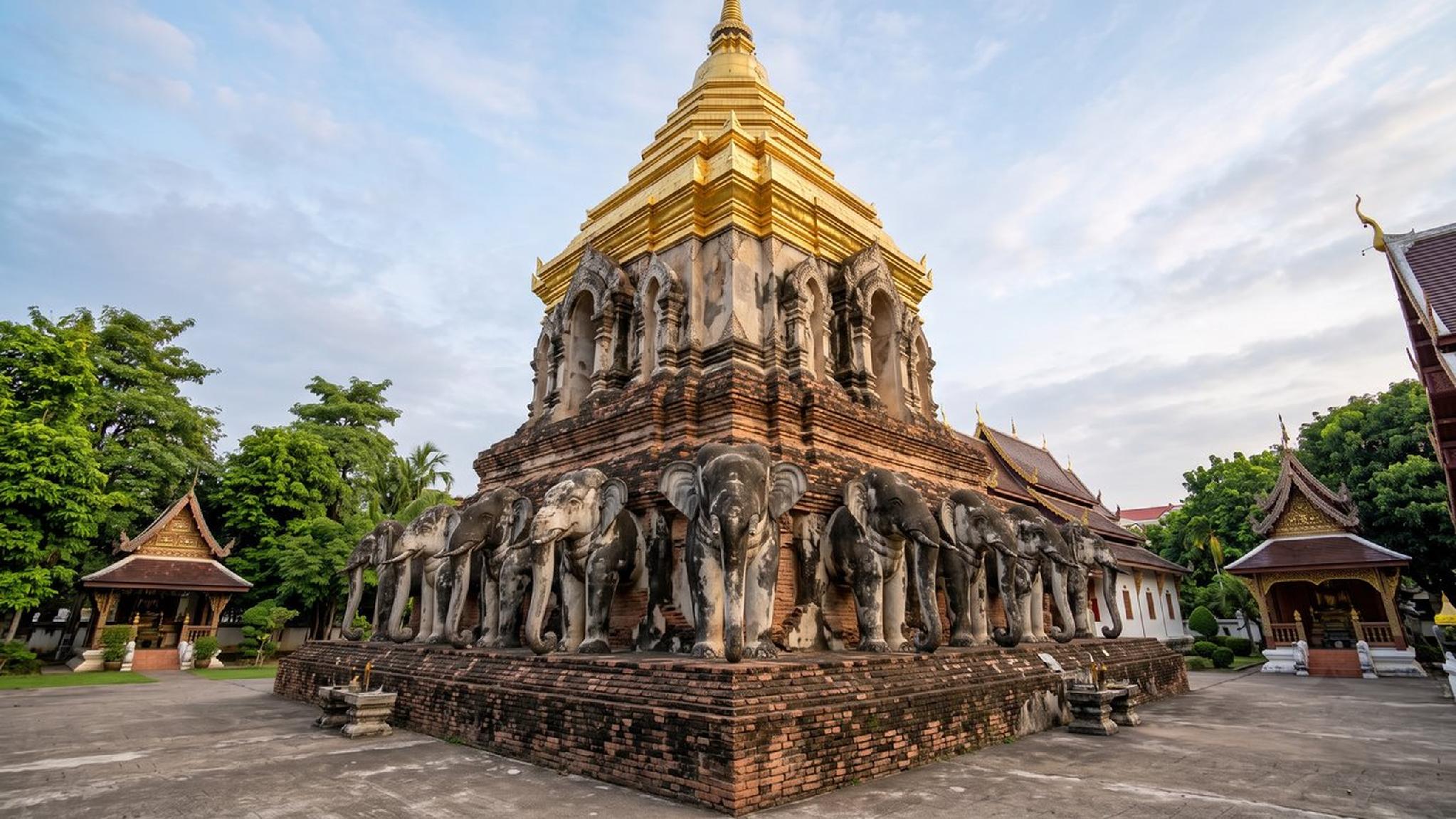 Golden stupa and elephant statues at Wat Chiang Man temple, Chiang Mai.