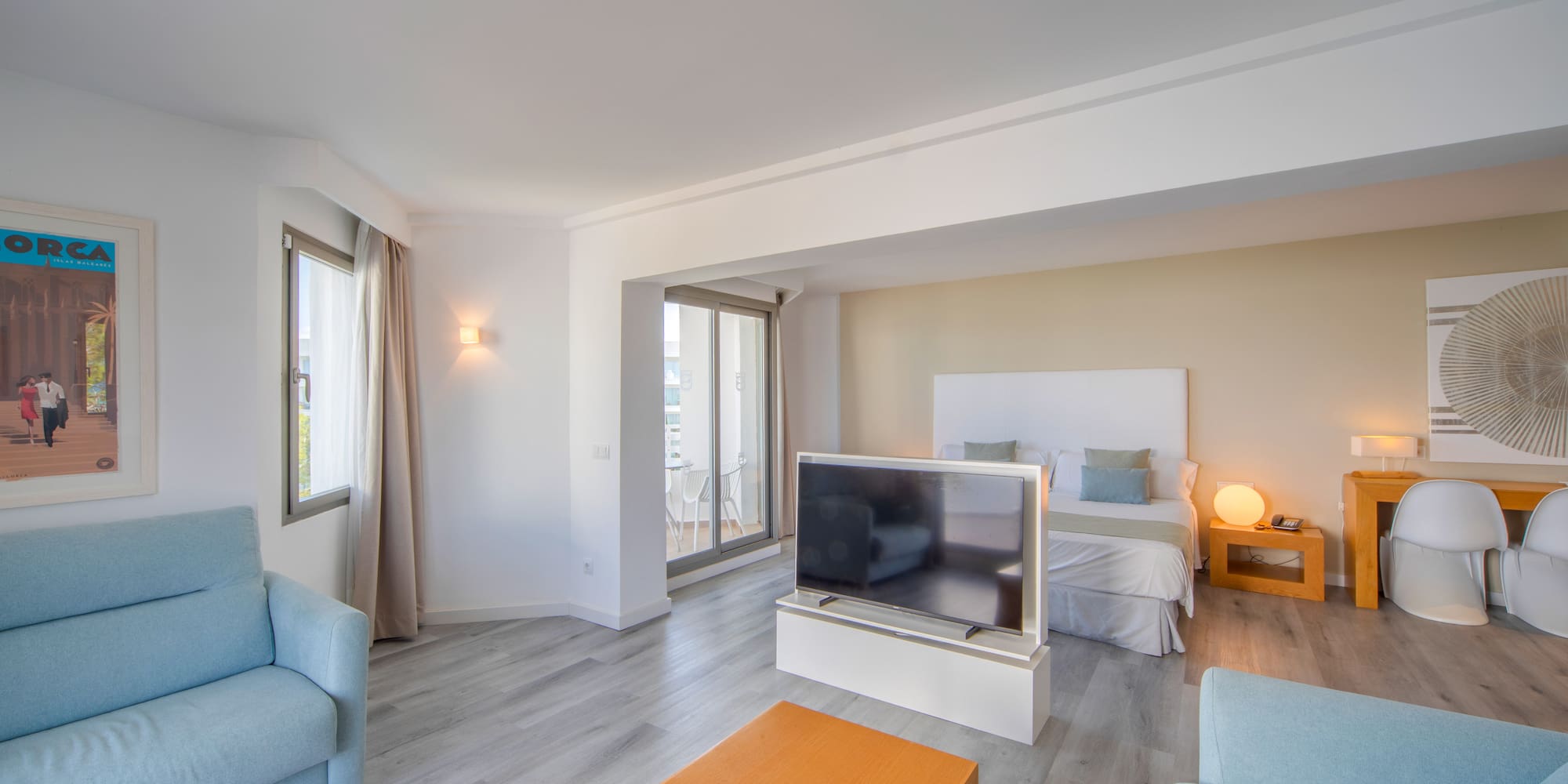 a room with a tv and couches