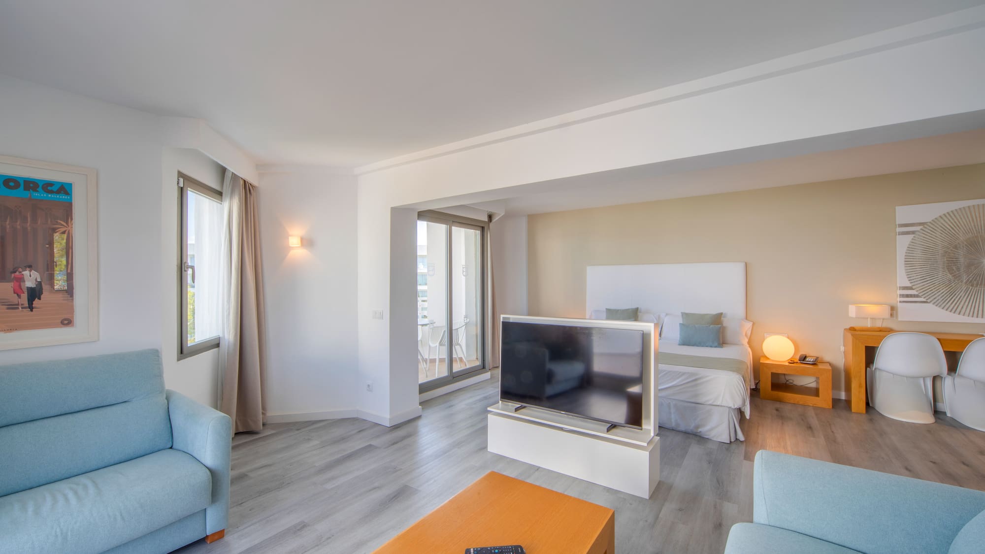 a room with a tv and couches