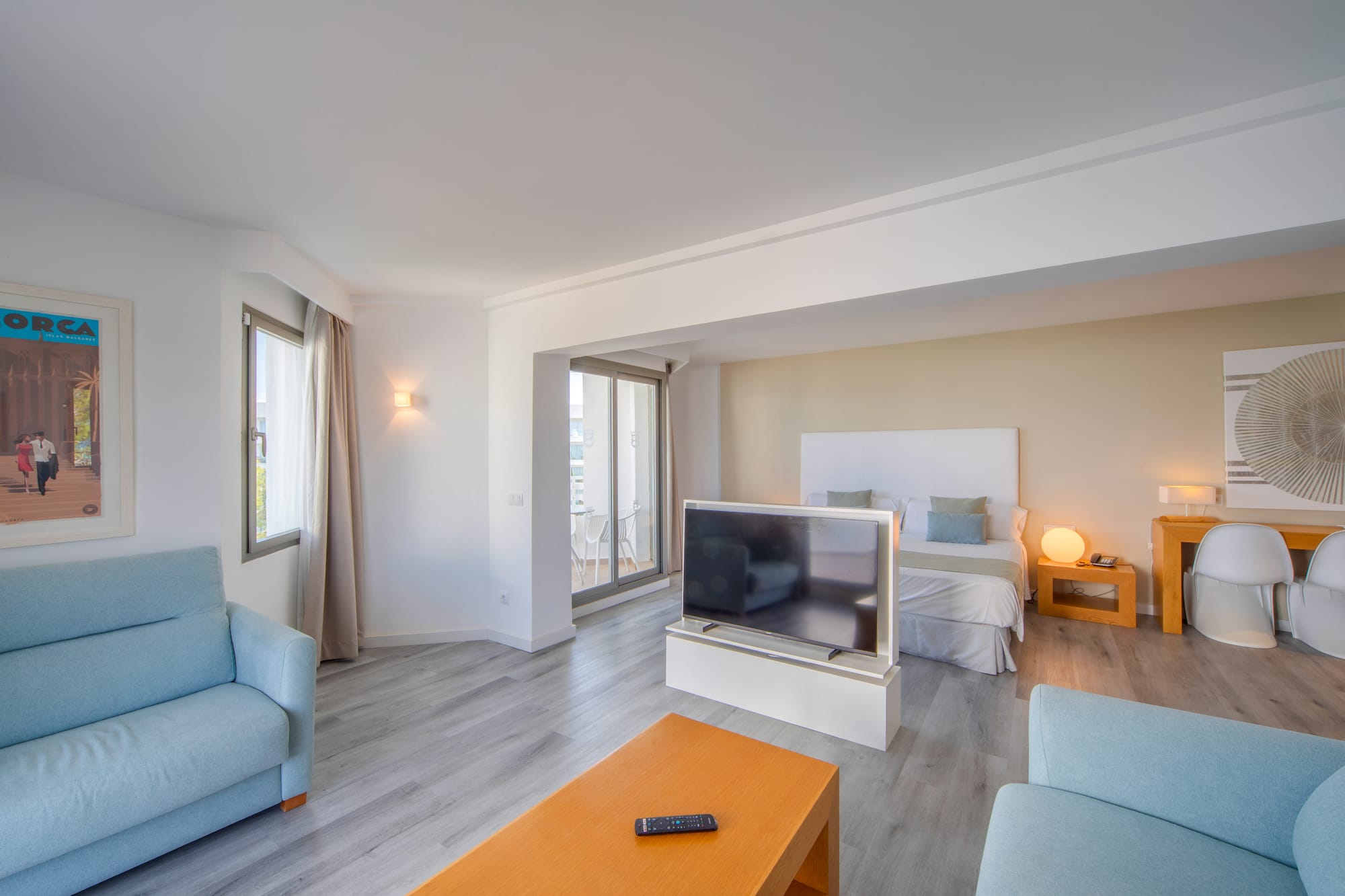 a room with a tv and couches