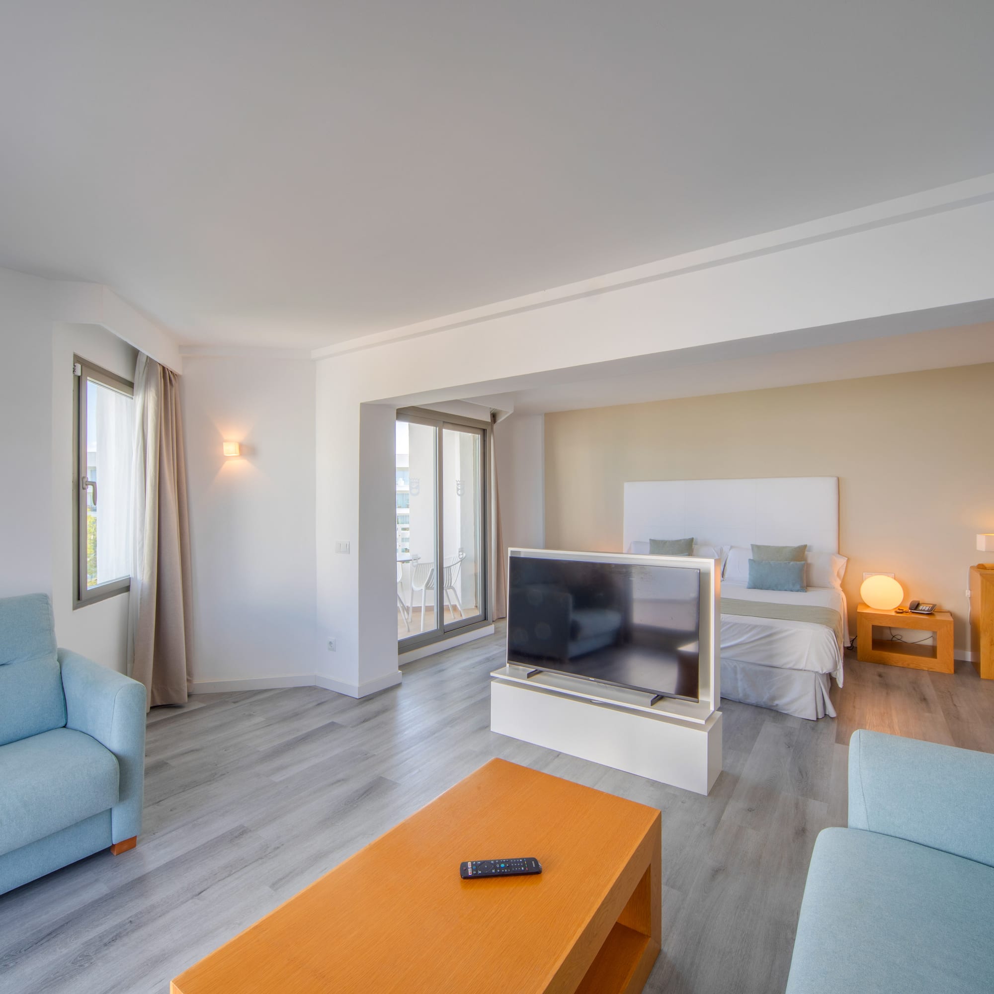 a room with a tv and couches