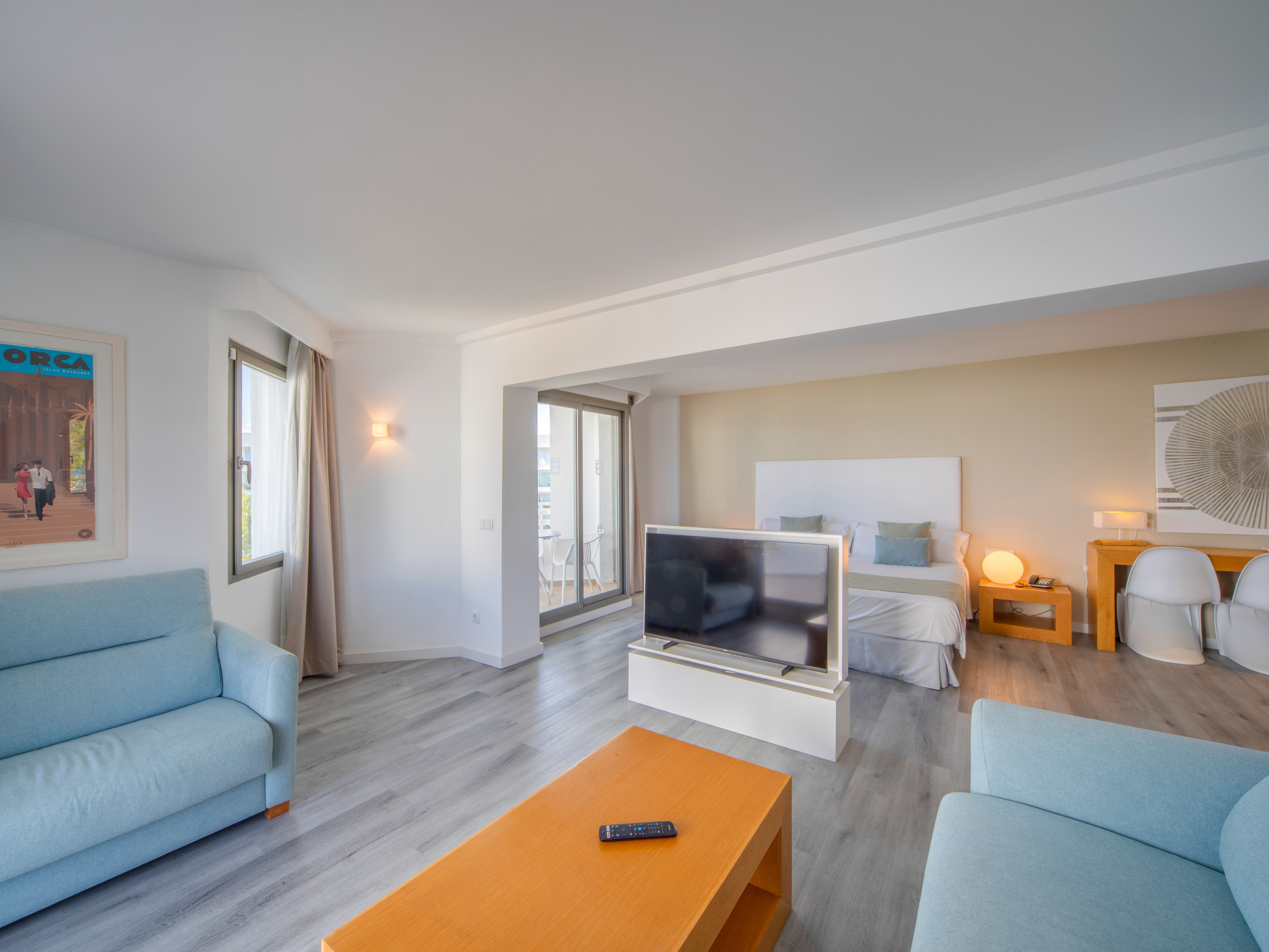 a room with a tv and couches