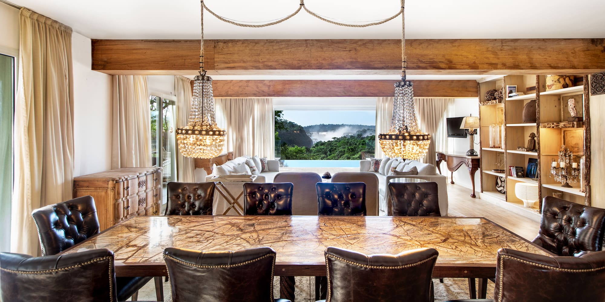 a dining room with a large table and chairs