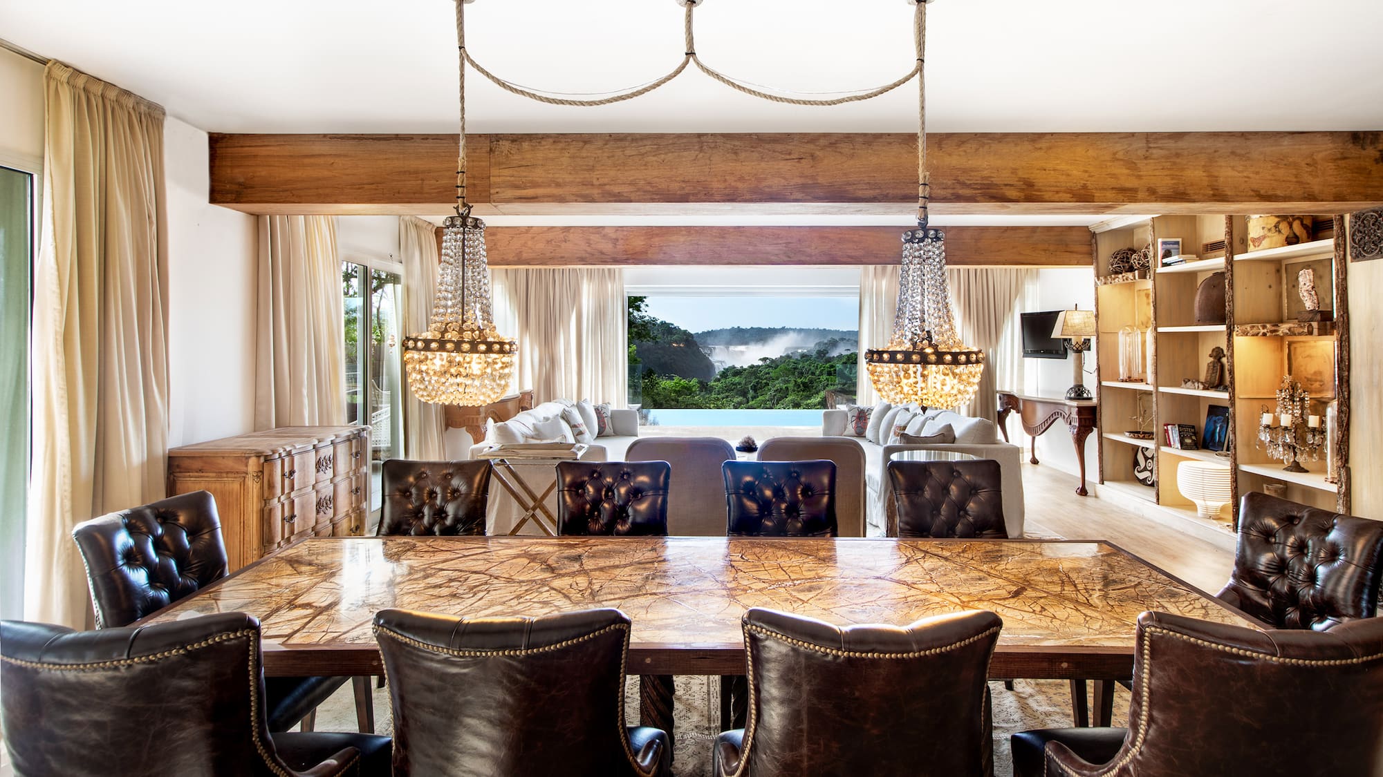 a dining room with a large table and chairs