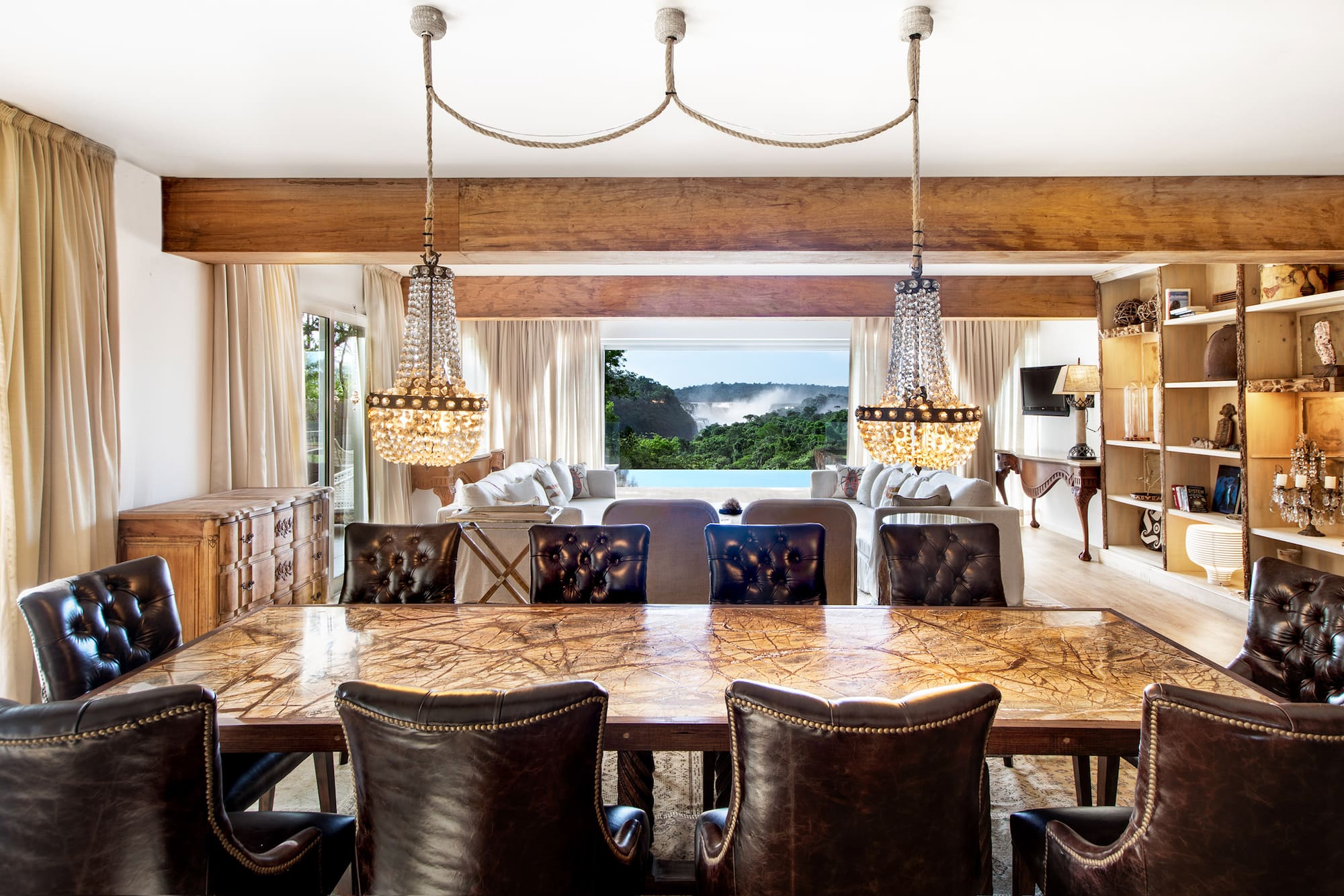 a dining room with a large table and chairs