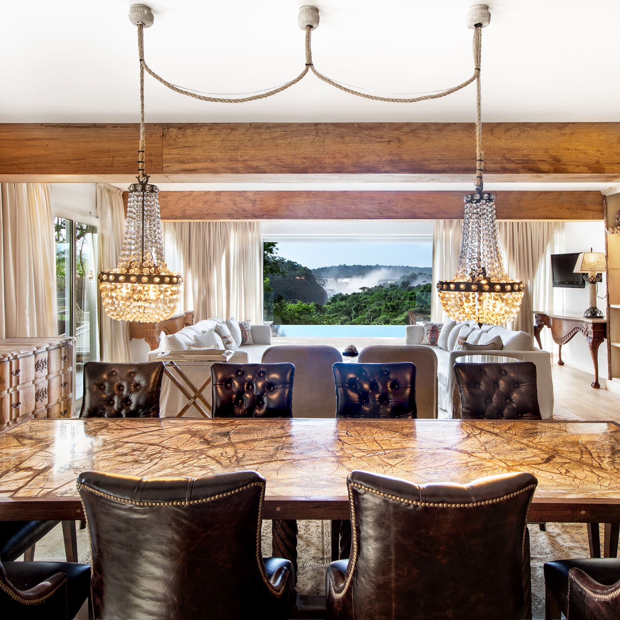 a dining room with a large table and chairs