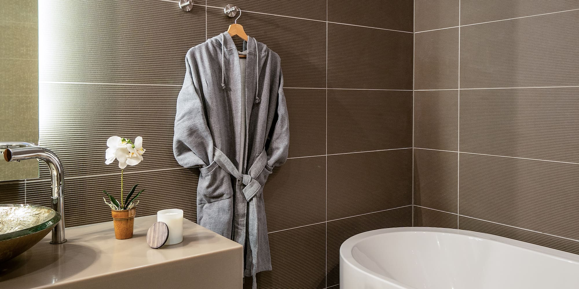 a bathrobe on a hook in a bathroom