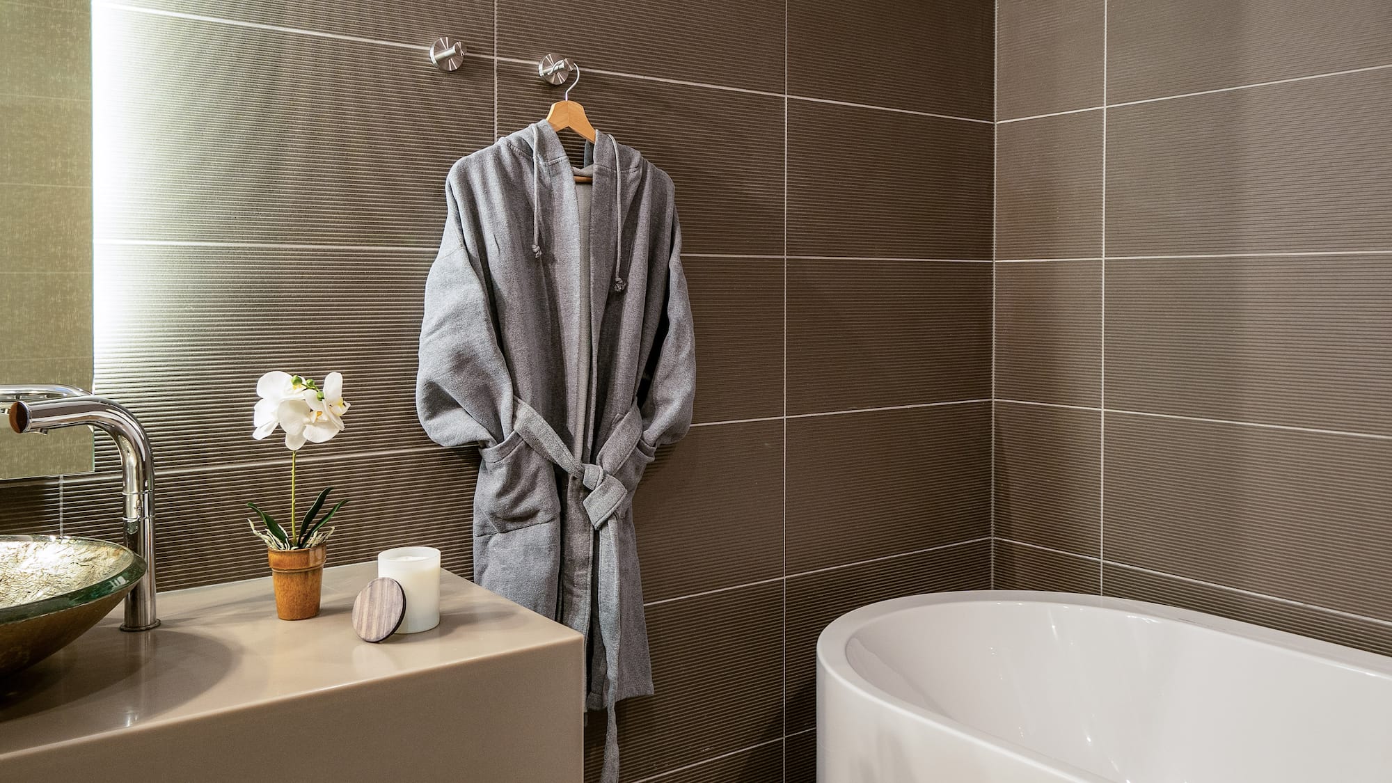 a bathrobe on a hook in a bathroom