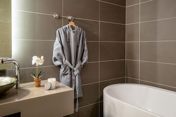 a bathrobe on a hook in a bathroom