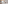 Bright hotel room with two twin beds, wall-mounted TV, and sheer curtains.