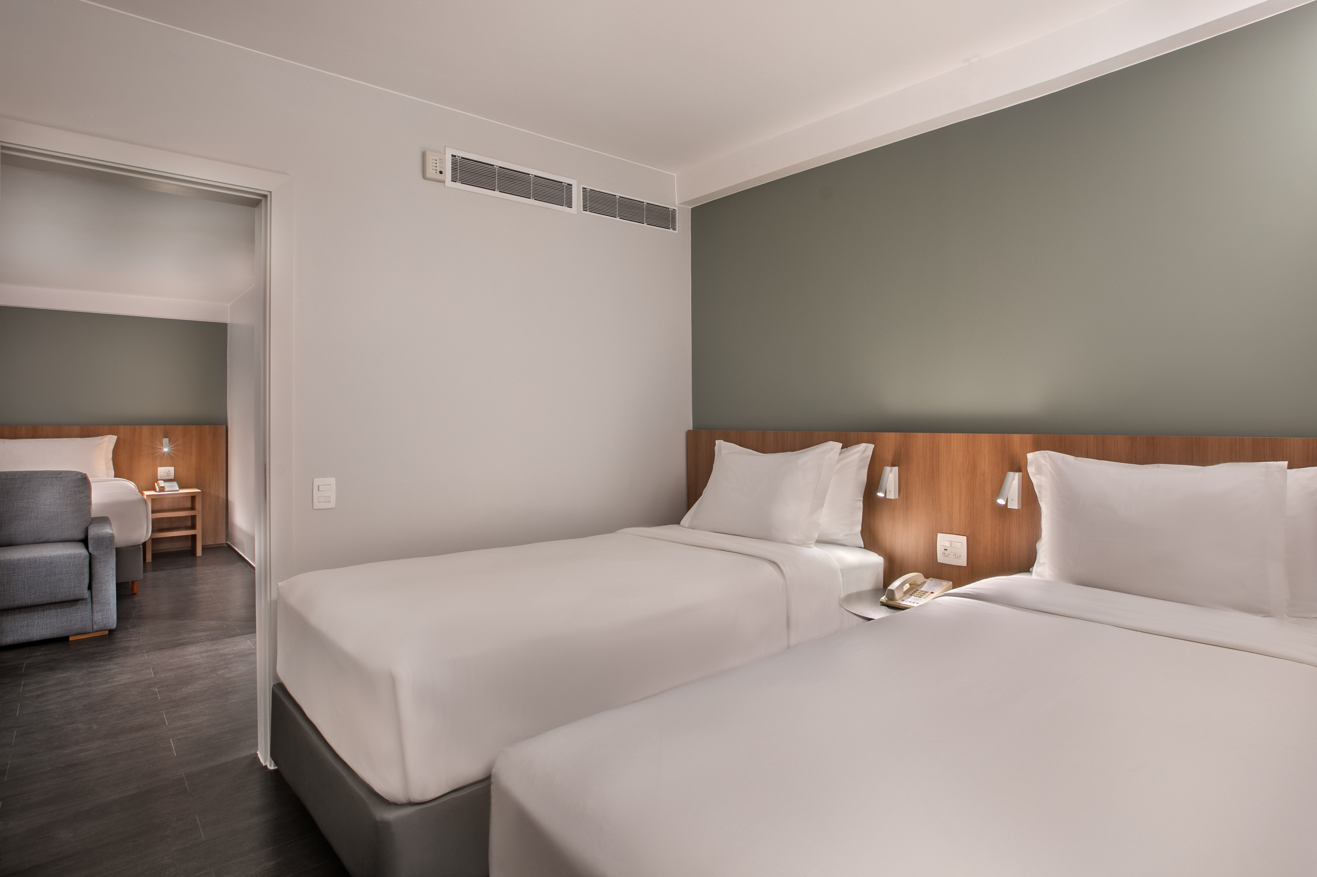 Modern twin hotel room with two single beds and connecting room. - The Loft for Families - INNSiDE São Paulo Higienópolis, Sao Paulo