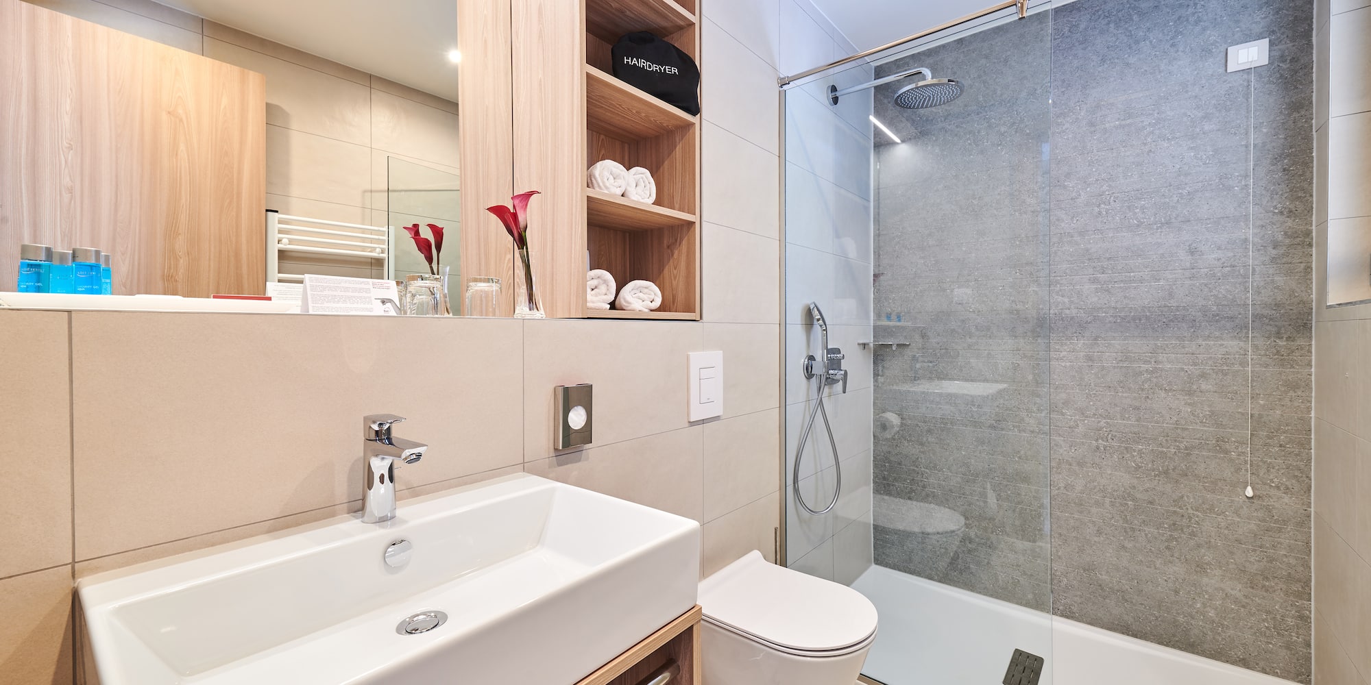 a bathroom with a shower and sink